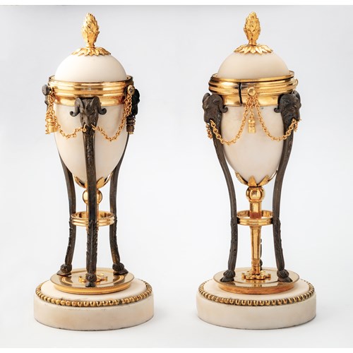 A pair of George III gilt and patinated bronze mounted white marble Cassolettes, England, c. 1790.